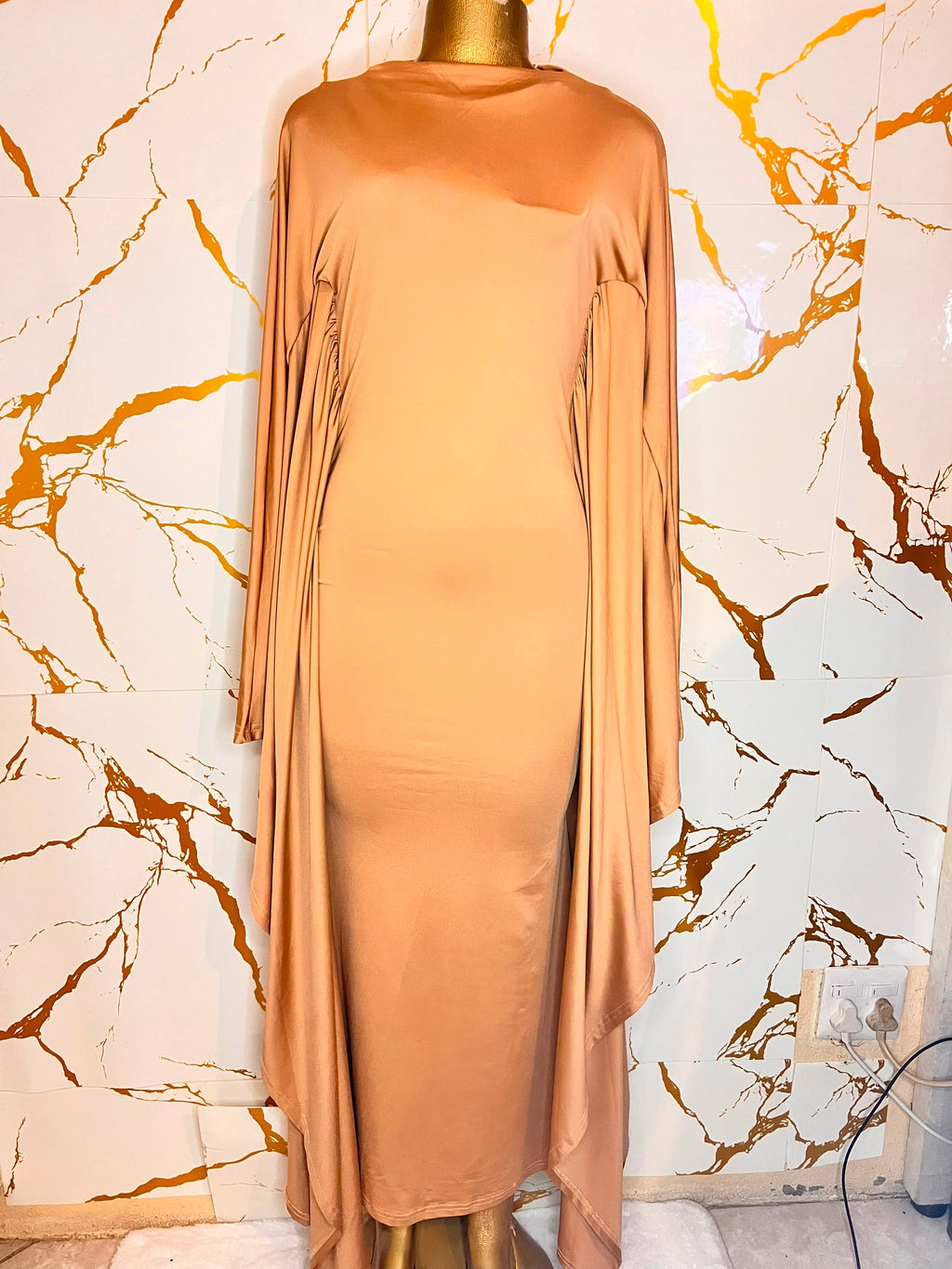 Peach satin dress,high neck, fitted silhouette, and draped side panels