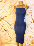 A navy blue bodycon midi dress with white trim and side cutouts