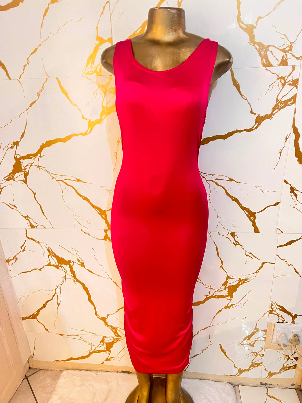 A bright red sleeveless bodycon dress